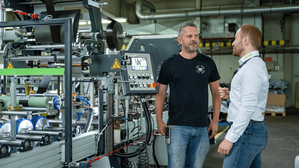 BE foreman and Duespohl Sales Engineer in front of the line