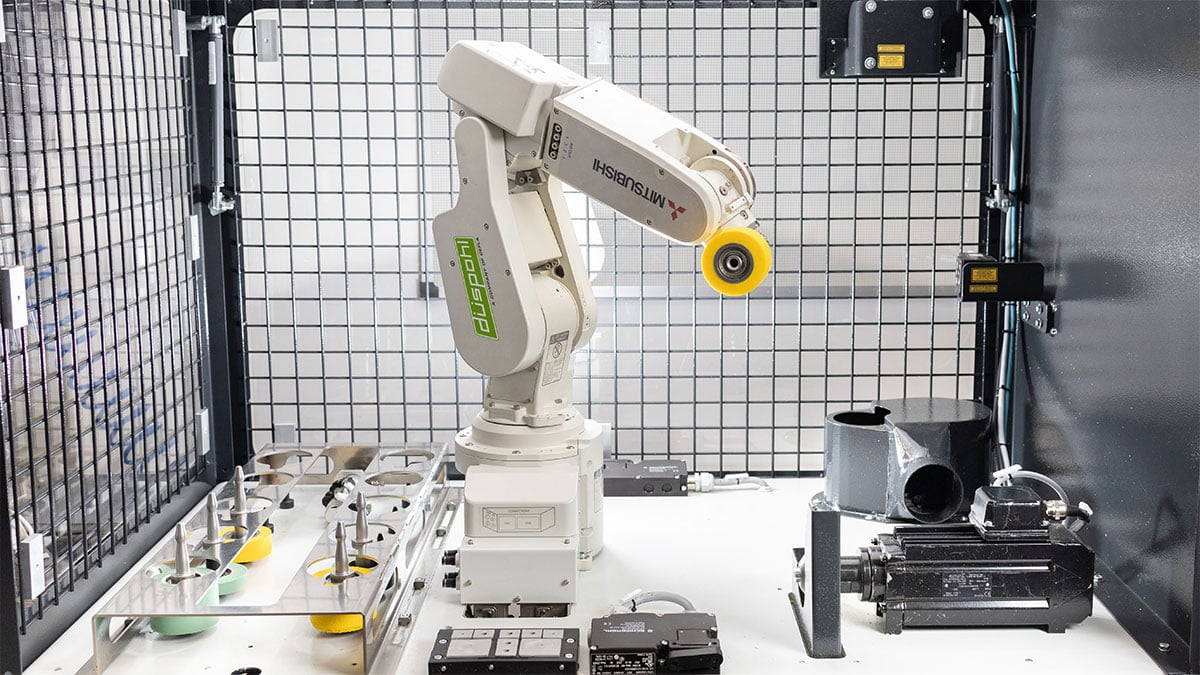 RoboGrinder, a robot that grinds pressure rollers